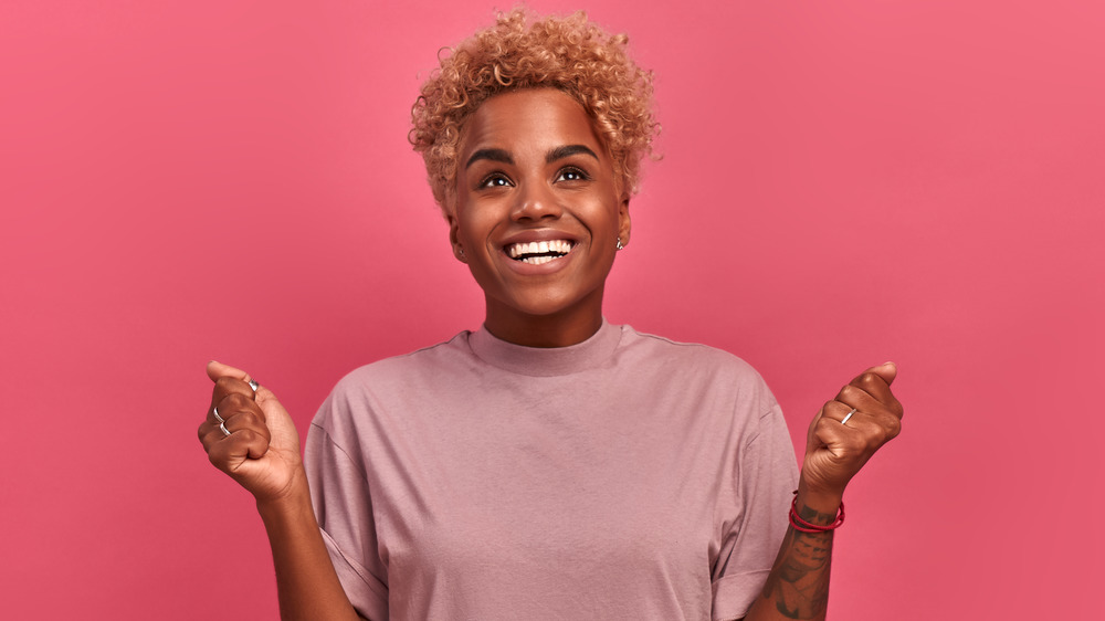 A woman with short and curly hair