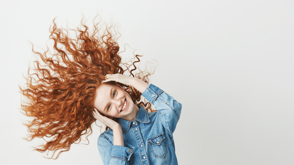 A redheaded woman with curly hair