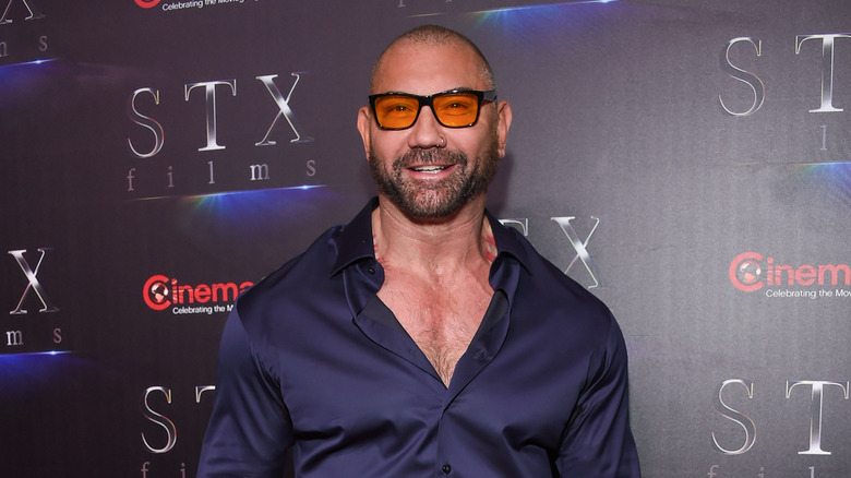 Dave Bautista smiles on the red carpet