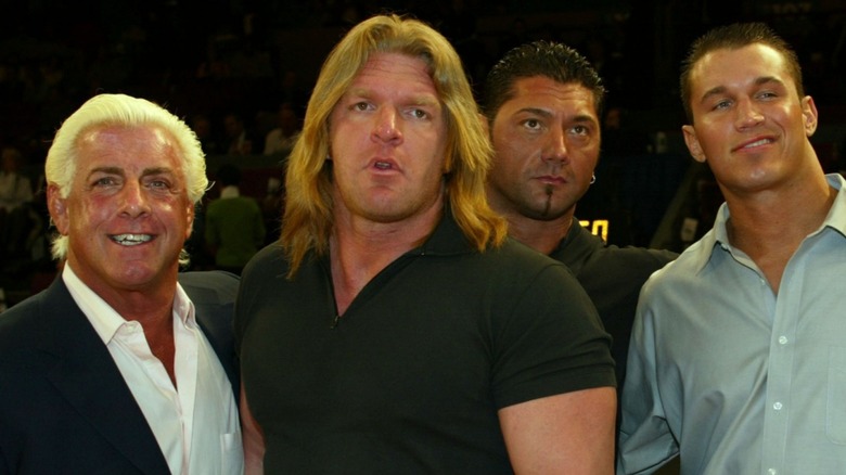 Ric Flair, triple H, Dave Bautista, and Randy Orton