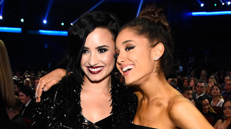 Demi Lovato and Ariana Grande smiling