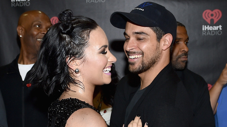 Wilmer Valderrama and Demi Lovato sharing a laugh