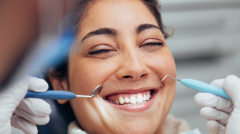 Woman smiling in a dentist chair