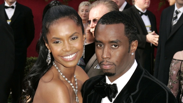 Kim Porter embracing Sean "Diddy" Combs