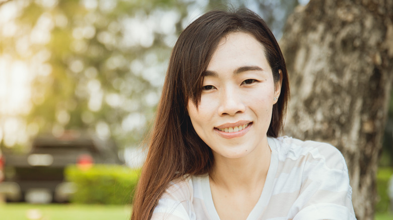 woman with dimples smiling