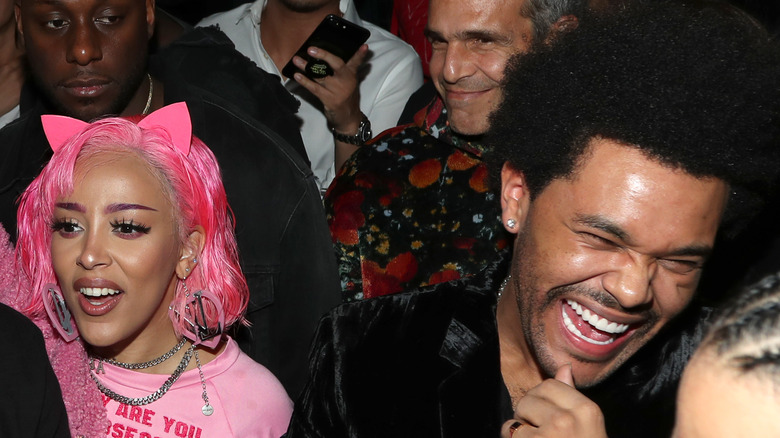 Doja Cat and The Weeknd laughing