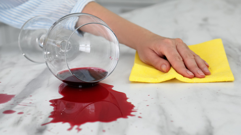 cleaning a wine stain with cleaner