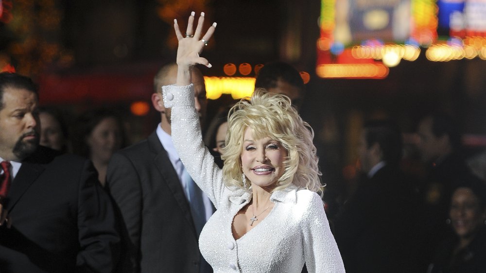 Dolly Parton's Arm Tattoos: A Symbol of Her Journey - wide 4