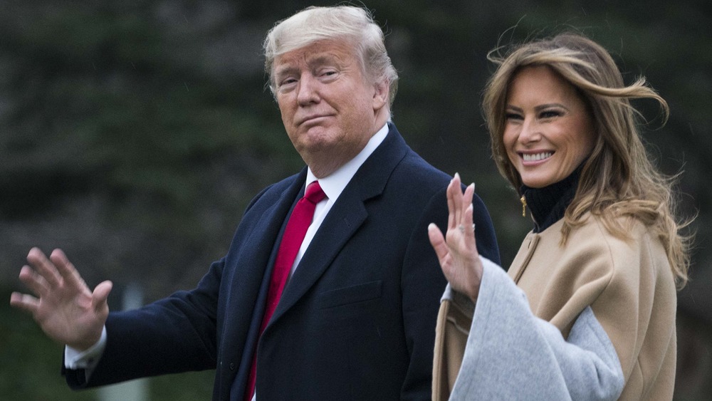 Donald and Melania Trump waving to people