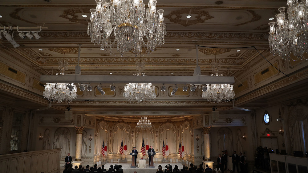 A ballroom with chandeliers at tMar-a-Lago 