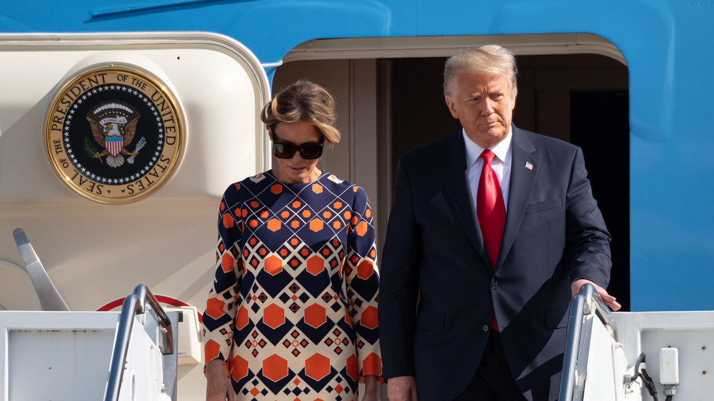 Donald and Melania Trump exiting a plane