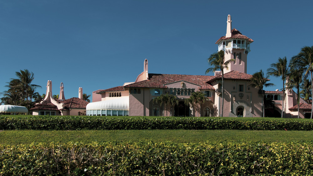The exterior of Mar-a-Lago with greenery