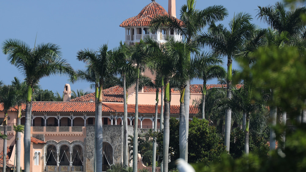 The exterior of Mar-a-Lago with palm trees