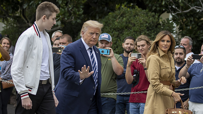 Barron Trump with his parents outside the White House