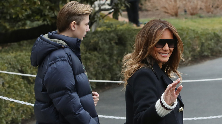 Barron and Melania Trump walking outside