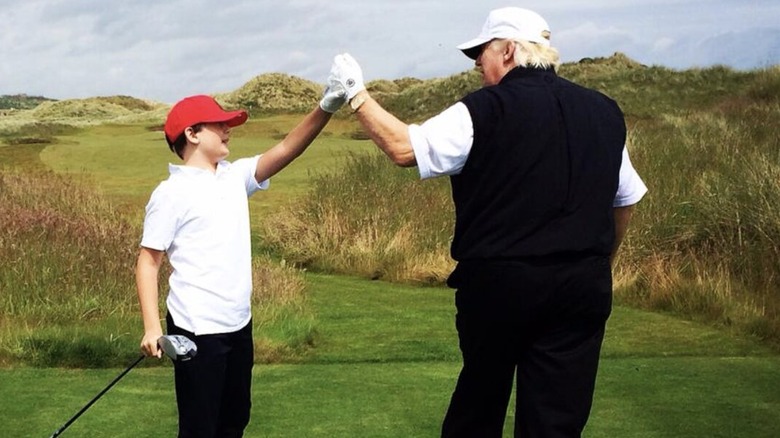 Barron Trump golfing with Donald Trump