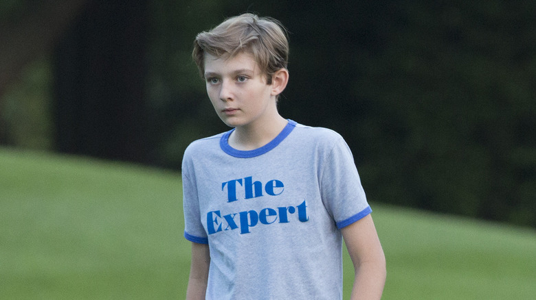 Barron Trump walking around outside