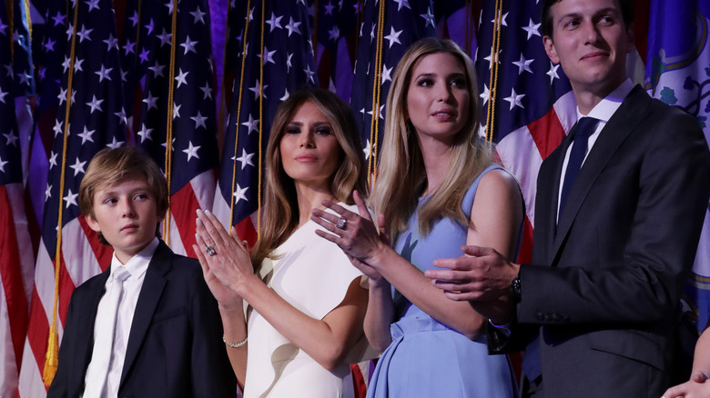 Barron Trump standing beside Melania Trump