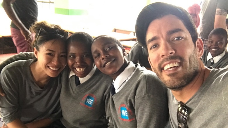 Drew Scott and Linda Phan with kids in Kenya