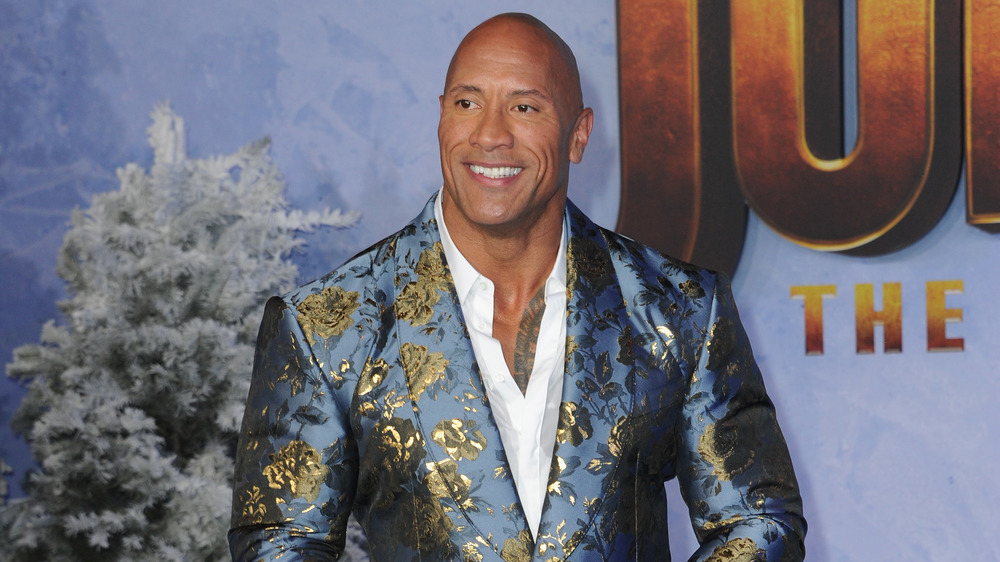 Dwayne Johnson posing on red carpet