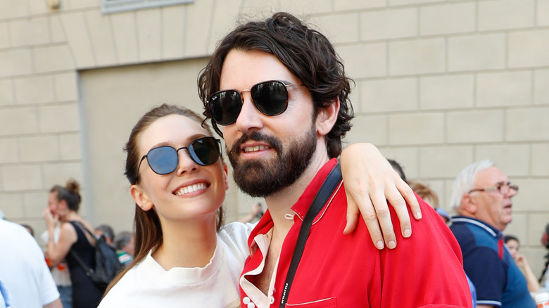 Elizabeth Olsen and Robbie Arnett wearing sunglasses