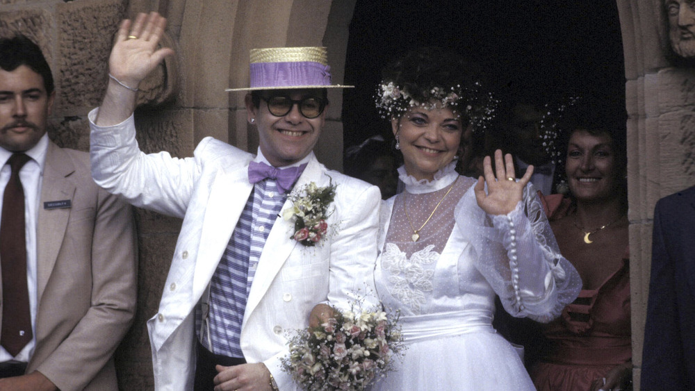 Renate Blauel and Elton John waving