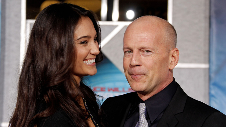 Bruce Willis posing with Emma Heming