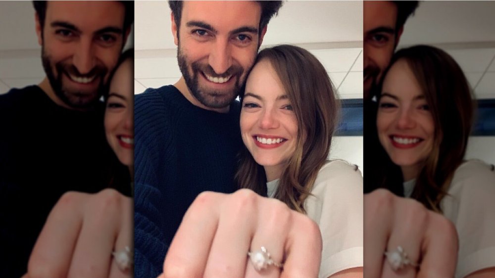 Dave McCary and Emma Stone wearing her engagement ring