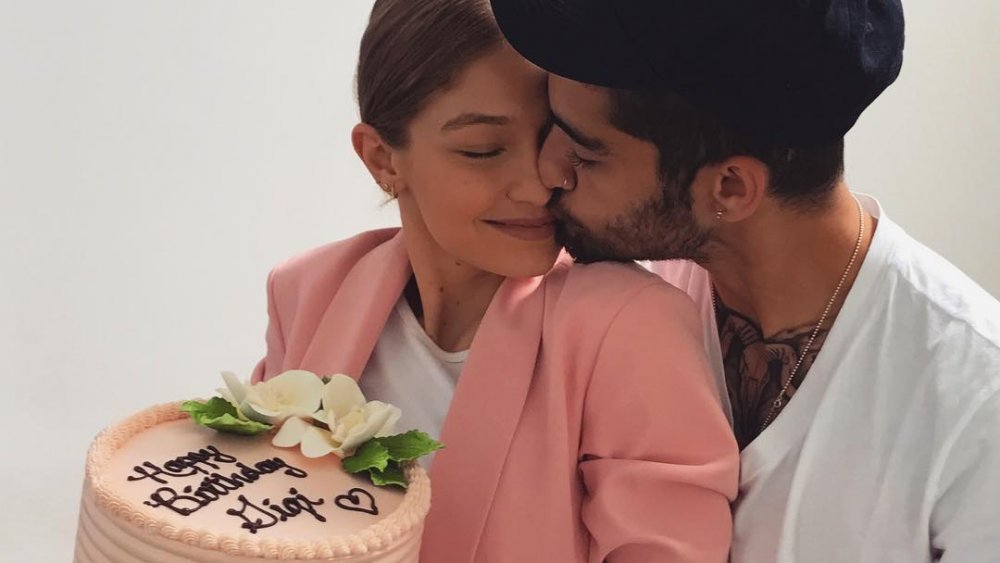 Gigi Hadid and Zayn Malik with a birthday cake