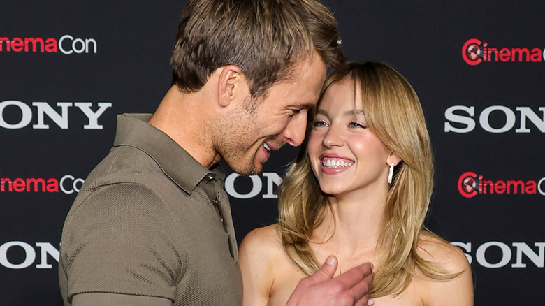 Glen Powell and Sydney Sweeney on a red carpet for "Anyone But You"