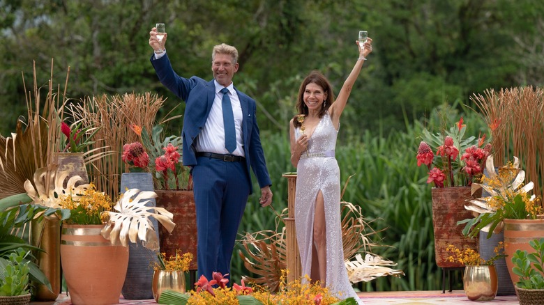 Gerry Turner and Theresa Nist holding glasses aloft