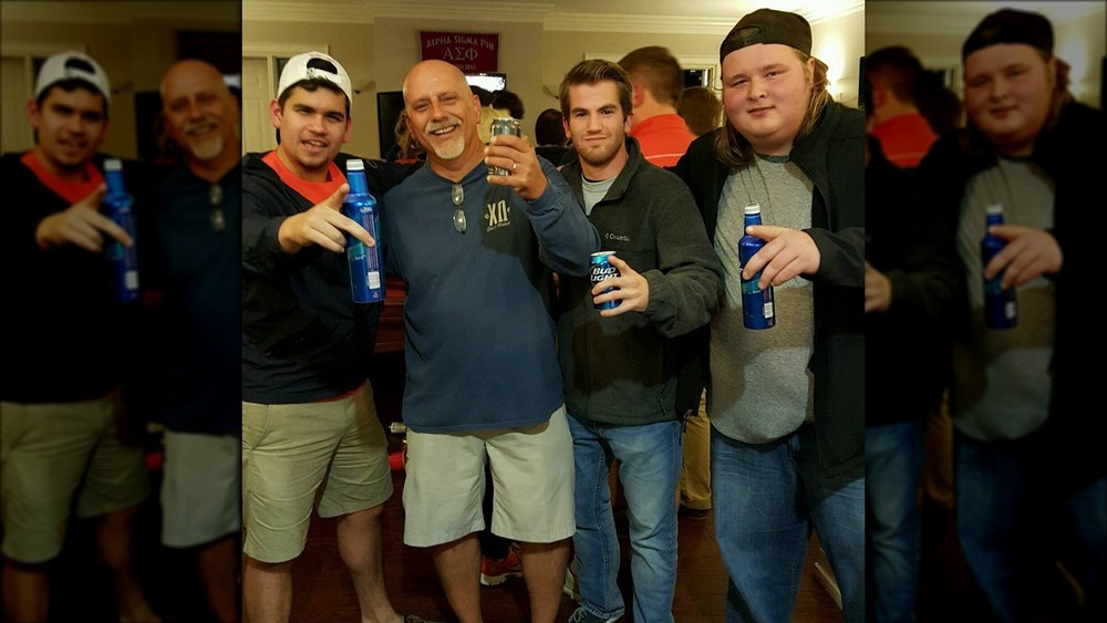 Austin Aynes drinking beer with friends