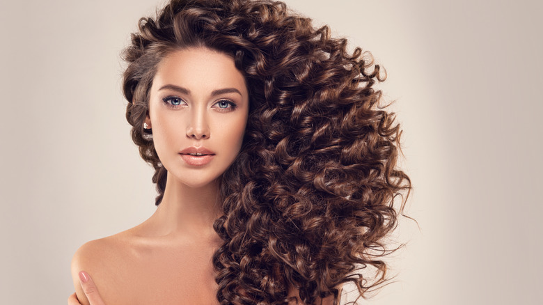 Woman with long curly hair