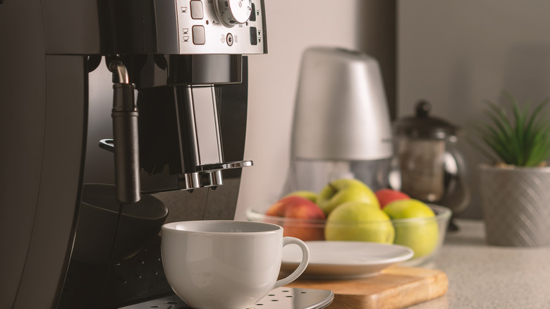 Coffee machine with white cup