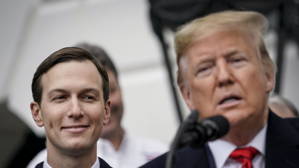 Jared Kushner smiling as Donald Trump speaks