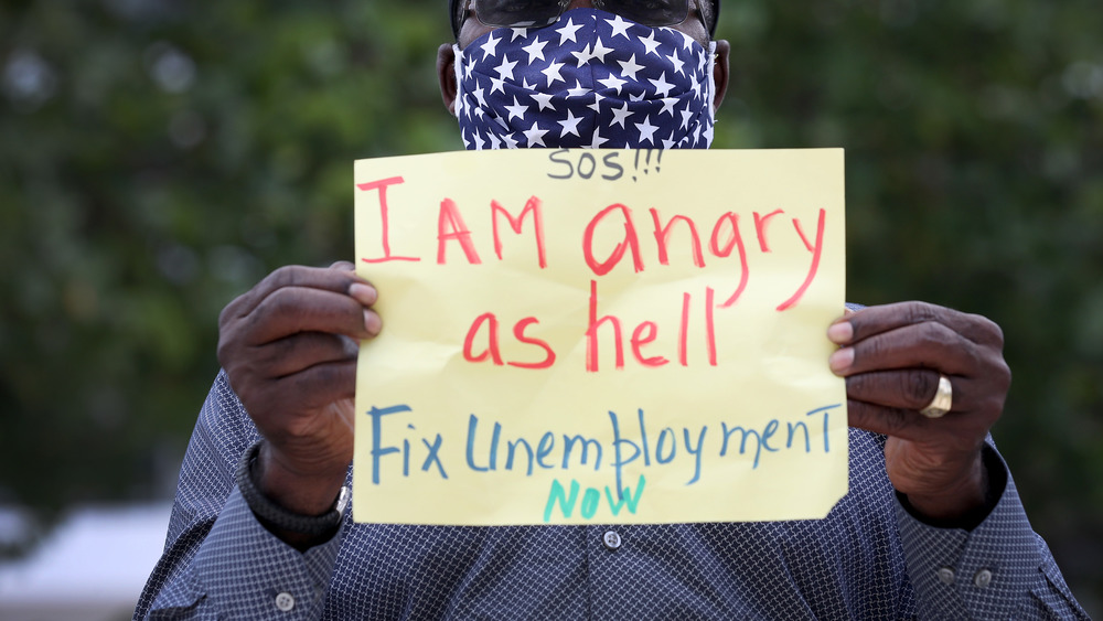 Protester asking for help on unemployment