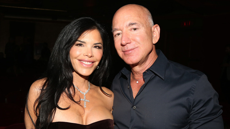 Jeff Bezos and Lauren Sanchez smiling for photos