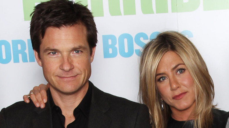 Jennifer Aniston's hand on Jason Bateman's shoulder