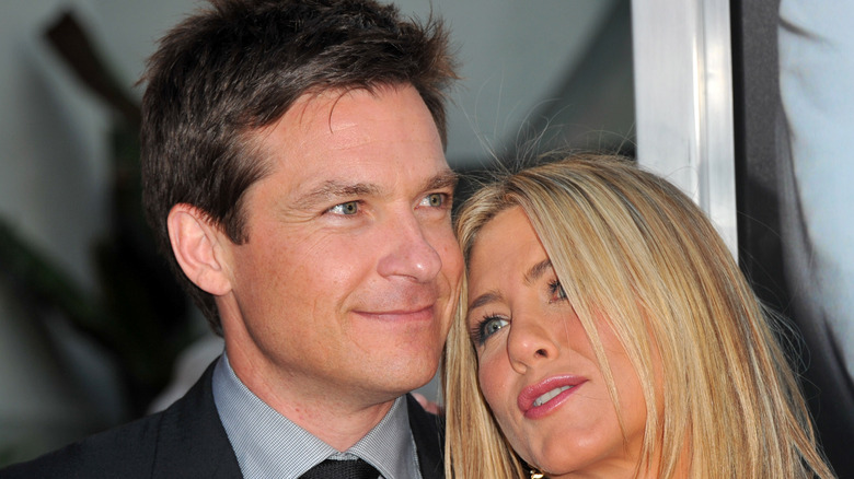 Jennifer Aniston leaning on Jason Bateman