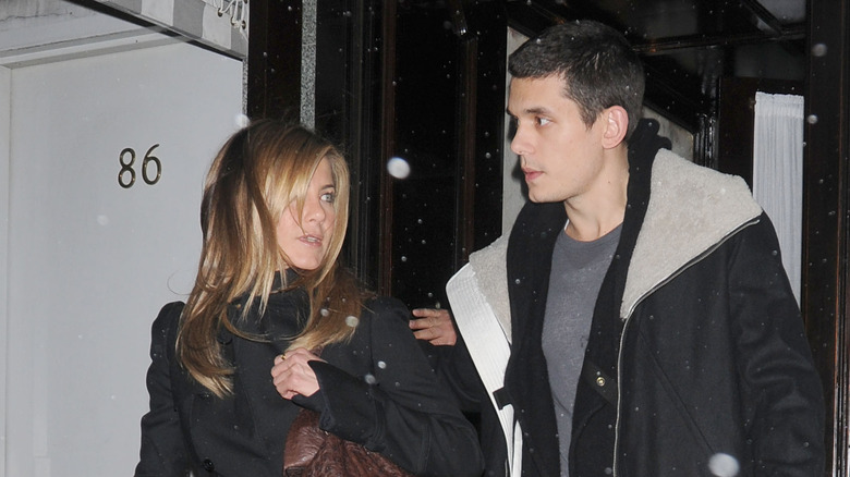 Jennifer Aniston, John Mayer walking in the snow