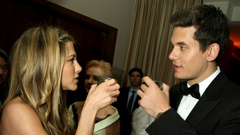 Jennifer Aniston and John Mayer drinking, talking