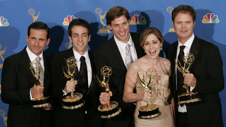 Cast of The Office posing with Emmys