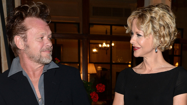 Meg Ryan and John Mellencamp staring at each other