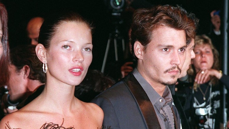 Johnny Depp and Kate Moss walking a red carpet