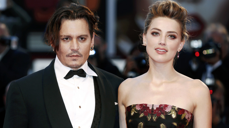 Johnny Depp and Amber Heard posing