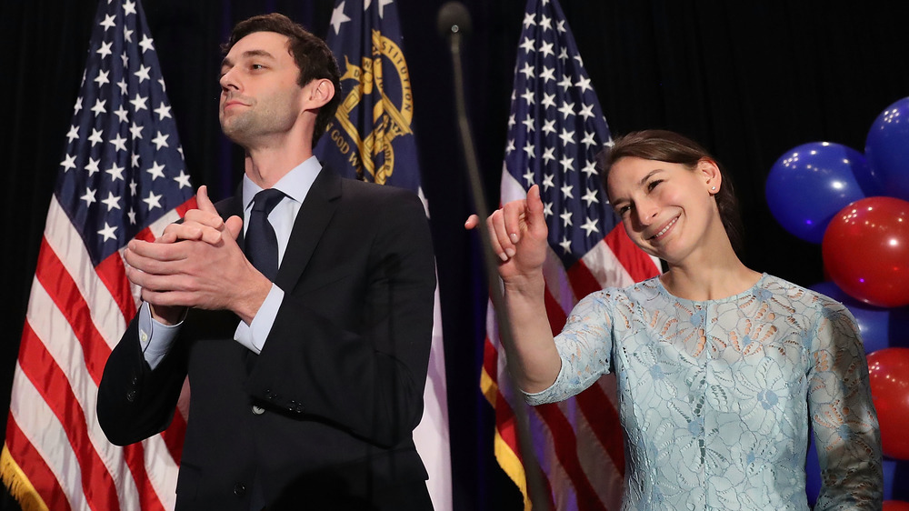  Jon Ossoff  clapping and Dr. Alisha Kramer waving