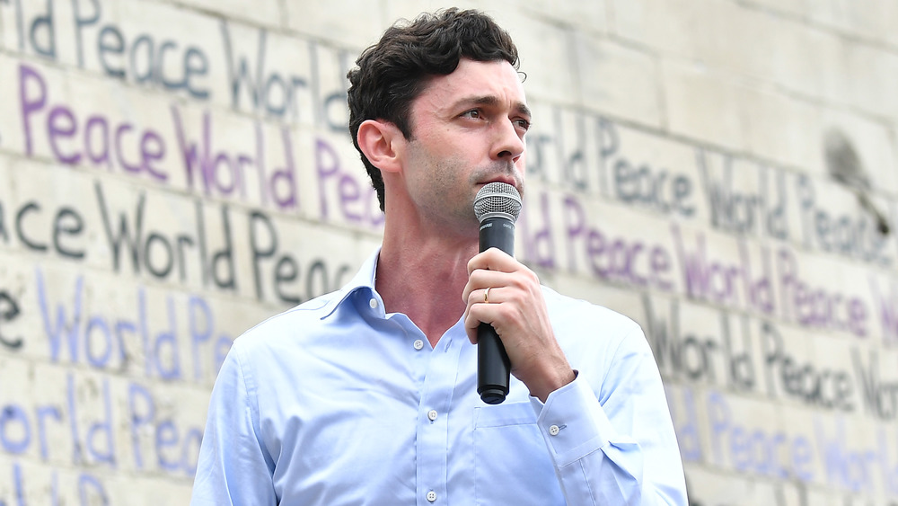 Democrat Jon Ossoff campaigning with microphone