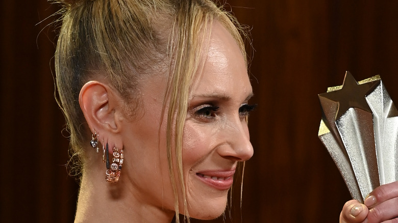 juno temple holding an award