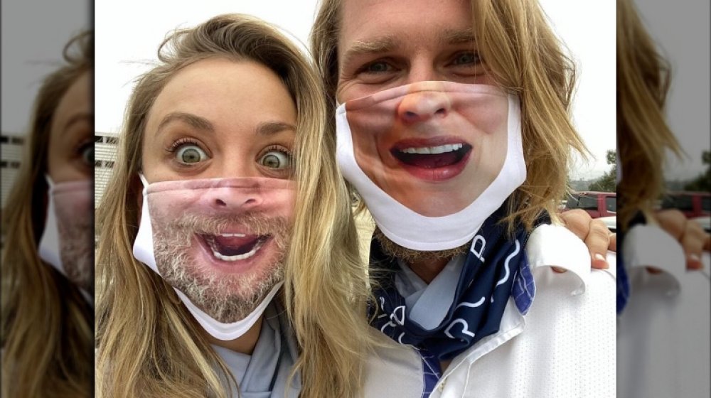 Kaley Cuoco and Karl Cook wearing silly masks