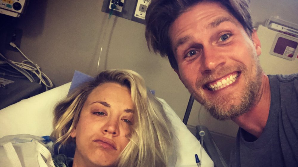 Kaley Cuoco in a hospital bed with Karl Cook at her side